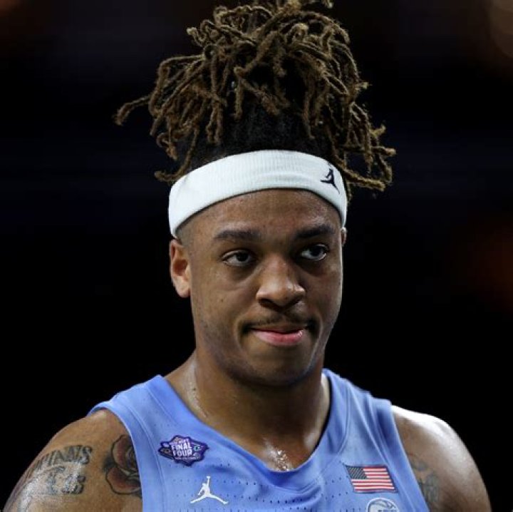 What does Armando Bacot tattoo say?